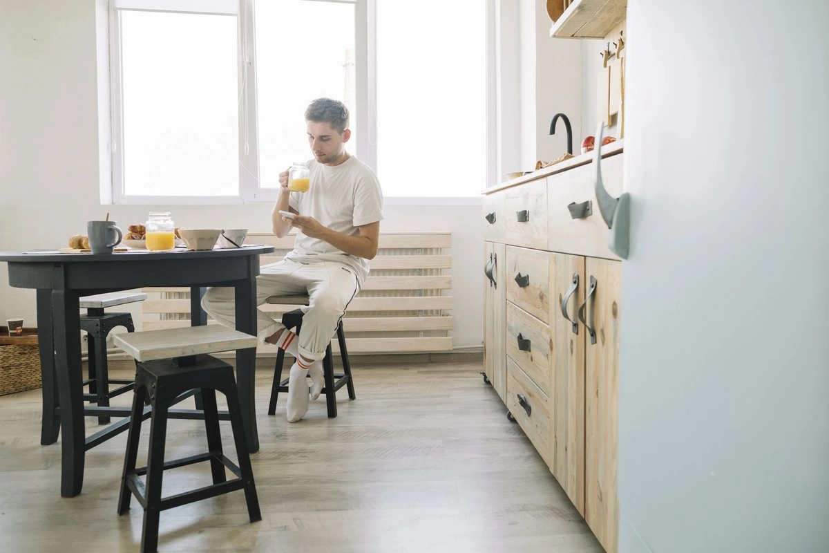 Man at kitchen table with LVT on the floor