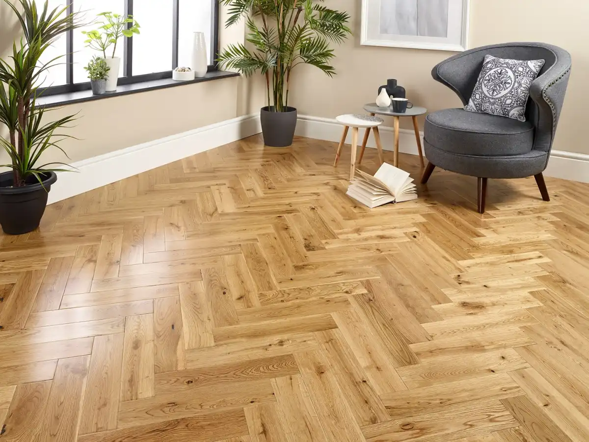 sofw with a book on the the lvt parquet flooring